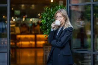 Young woman drinking coffee